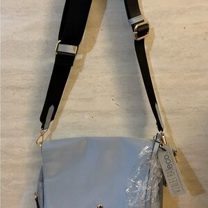 NWT- Violet Ray faux leather crossbody bag in a ice blue removable coin purse
